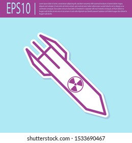 Retro purple Nuclear rocket icon isolated on turquoise background. Rocket bomb flies down.  Vector Illustration