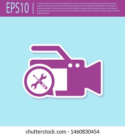 Retro purple Video camera with screwdriver and wrench icon isolated on turquoise background. Adjusting, service, setting, maintenance, repair, fixing.  Vector Illustration