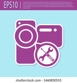 Retro purple Video camera with screwdriver and wrench icon isolated on turquoise background. Adjusting, service, setting, maintenance, repair, fixing.  Vector Illustration