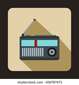 Retro radio receiver icon in flat style on a beige background