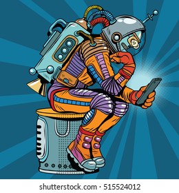 Retro robot astronaut in the thinker pose reads smartphone, pop art retro vector illustration. Science fiction and robotics, space and science