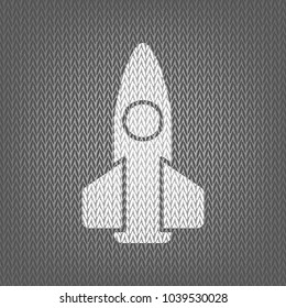 Retro Rocket sign illustration. Vector. White knitted icon on gray knitted background. Isolated.