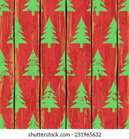 Retro seamless pattern with Christmas trees on a red wooden boards background