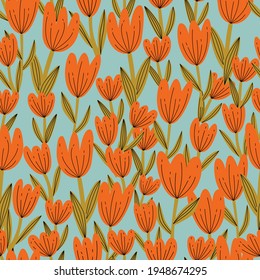 Patrón retro sin fisuras con flores de tulipán en colores mudos azul, verde, rojo