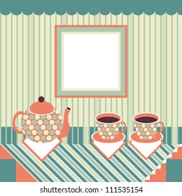 Retro style teapot and two cups standing on table covered with striped tablecloth