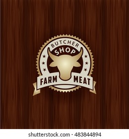 retro styled golden metal emblem of butcher meat shop logo on vintage wood texture bovine butcher animal classic product meat ranch cutlery swine natural deadly metal inferno nourishment pork wood mar
