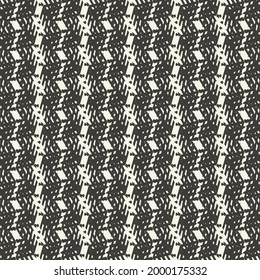 Retro textile pattern with zigzag stripes and flecks. Thick wool fabric woven in black and white.