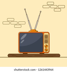 Retro tv with antenna on the table.