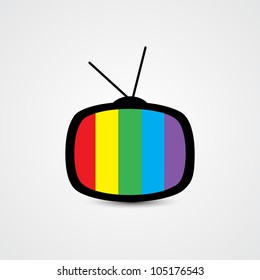 Retro TV Icon – Rainbow Screen with Antenna and Black Outline on Gray Background. A stylized retro television icon featuring a rounded rectangular screen with vertical rainbow-colored stripes—red, yellow, green, blue, and purple. The TV has two antennae on top and a black outline, set against a light gray gradient background. This vibrant and nostalgic design is ideal for use in media-related graphics, entertainment branding, diversity-themed visuals, and editorial layouts. Suitable for both commercial and editorial use across print and digital platforms, especially in contexts involving broadcasting, retro aesthetics, or colorful storytelling.