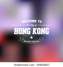 Retro Typography. Travel label on blurry background - "Welcome to the city of Hong Kong, and enjoy your stay". Vector design. 