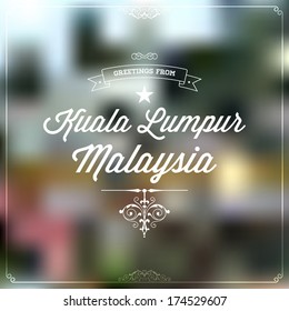 Retro Typography, Vintage Travel Greeting label on blurry background "Greetings from Kuala Lumpur, Malaysia", Vector design. 