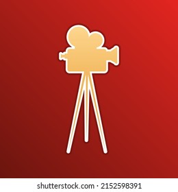 Retro Video Recording Camera On Tripod Sign. Golden Gradient Icon With Contours On Redish Background. Illustration.