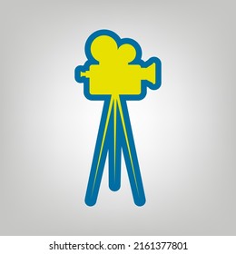 Retro Video Recording Camera On Tripod Sign. Icon In Colors Of Ukraine Flag (yellow, Blue) At Gray Background. Illustration.