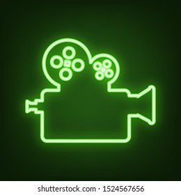 Retro video recording camera sign. Green neon icon in the dark. Blurred lightening. Illustration.