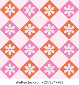 Retro white flowers on pink and orange Harlequin diamond shapes seamless pattern. For fabric, textile and home décor. 