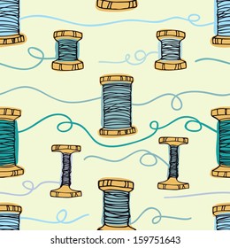 Retro wooden reels of thread. Threads in blue colors. Hand drawing