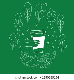 Reusable cup among treas and leaves.