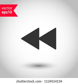 Rewind arrow media button icon. EPS 10 vector sign. Studio background.
