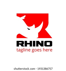 Rhino head letter based initial R symbol vector illustration in negative space style. a bold sporty look symbol perfect for brand identity, logo, or any other purpose.