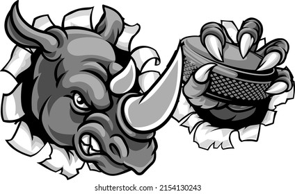 A rhino ice hockey player animal sports mascot holding a puck