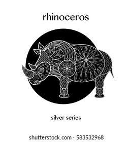 Rhinoceros decoration. African animal print silver foil on a black background. Vector illustration art. Linear image. Motifs of flowers, leaves, geometry. Black and white.