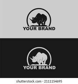 Rhinoceros standing vector logo silhouette isolated on white background simple