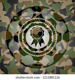 ribbon icon inside camouflaged emblem