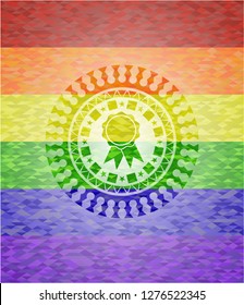 ribbon icon inside emblem on mosaic background with the colors of the LGBT flag