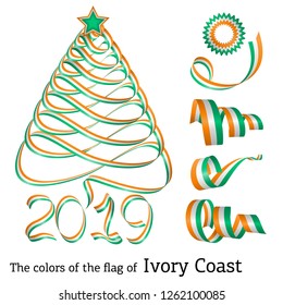 Ribbon in the shape of a Christmas tree with the colors of the flag of Ivory Coast