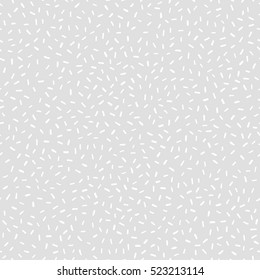 Rice background. Abstract vector texture for your design (wrapping paper, fabric, wallpaper). White rice on light gray background. Seamless pattern with scattered rice seeds.