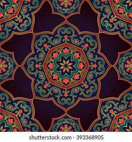 Rich, colorful ornament of mandala on a dark blue background. Template for oriental carpets, shawls, textiles, fabric, wrapping paper.