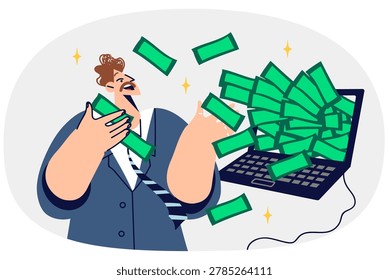 Rich man freelancer gets lot of money for working on internet, stands near laptop with dollars. Freelance guy earning money from cryptocurrency trading or investing in online business
