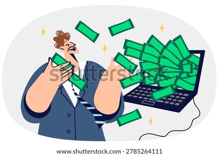 Rich man freelancer gets lot of money for working on internet, stands near laptop with dollars. Freelance guy earning money from cryptocurrency trading or investing in online business