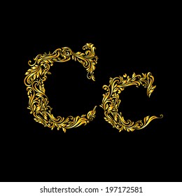 Richly decorated letter 'c' in upper and lower case on black background.