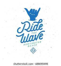 Ride the wave surfing typography. Surfing activity related quote. Handmade lettering print. Design element for t-shirt prints posters advertising. Vector vintage illustration.