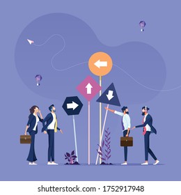 Right direction concept-Business group looks at many different directions sign
