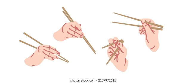 Right hand of person using bamboo chopsticks on white background