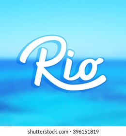 Rio.  Lettering. Blurred sea background. 