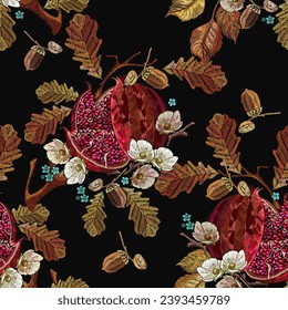 Ripened red pomegranate, autumn leaves and white flowers. Seamless pattern. Embroidery style. Fall garden art. Fashion template for design, textile