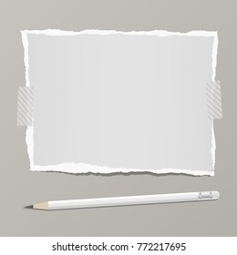 Ripped blank note, notebook paper for text or message stuck with sticky tape on gray background with pencil.