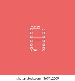Ripped film strip. Celluloid icon.