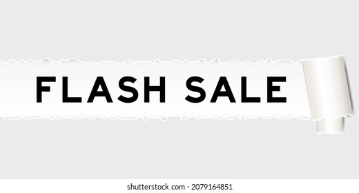 Ripped gray paper background that have word flash sale under torn part