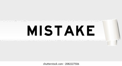 Ripped gray paper background that have word mistake under torn part