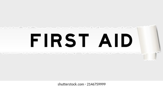 Ripped gray paper background that have word first aid under torn part