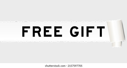 Ripped gray paper background that have word free gift under torn part