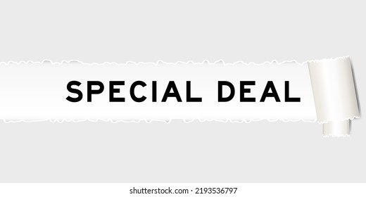 Ripped gray paper background that have word special deal under torn part