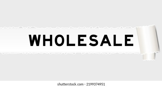 Ripped gray paper background that have word wholesale under torn part