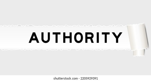 Ripped gray paper background that have word authority under torn part
