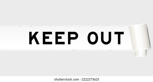 Ripped gray paper background that have word keep out under torn part
