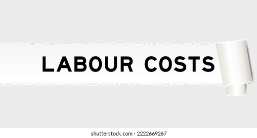 Ripped gray paper background that have word labour costs under torn part